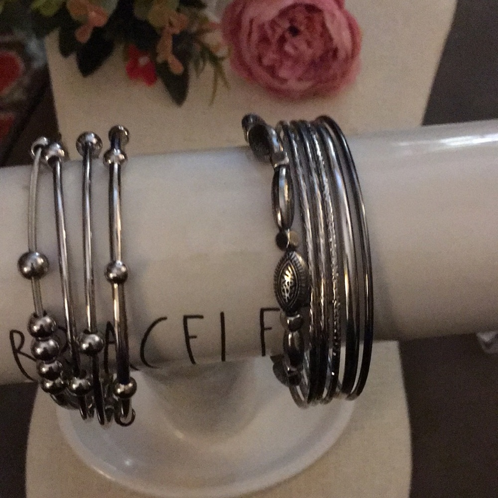 Circle Knots. Set of 10 mixture bangles and stretch bracelets in silver tone.
